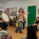 Trinity University College students sharing rhythm and energy during a drum circle at A Casa di Amici in Palermo.